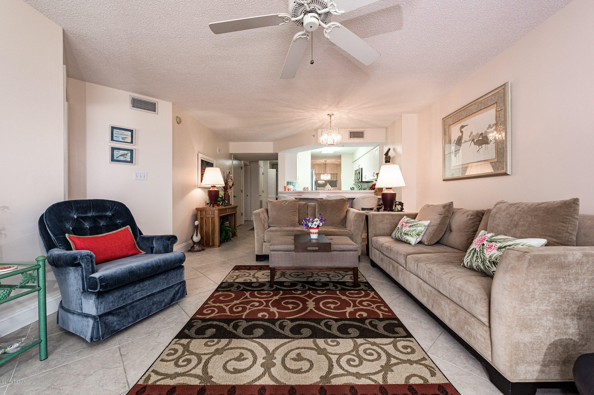 1183 Ocean Shore Boulevard, Unit 602 Ormond Beach, FL 32176 - Photo 11 of 27 a living room with furniture and a rug