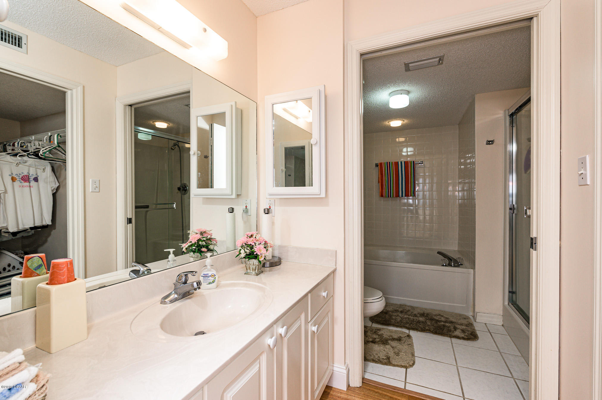 1183 Ocean Shore Boulevard, Unit 602 Ormond Beach, FL 32176 - Photo 15 of 27 a bathroom with a sink and a mirror