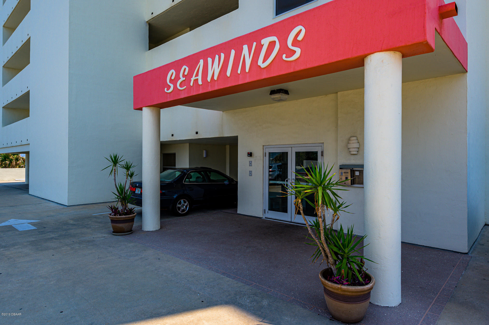 1183 Ocean Shore Boulevard, Unit 602 Ormond Beach, FL 32176 - Photo 2 of 27 a view of a street with potted plants