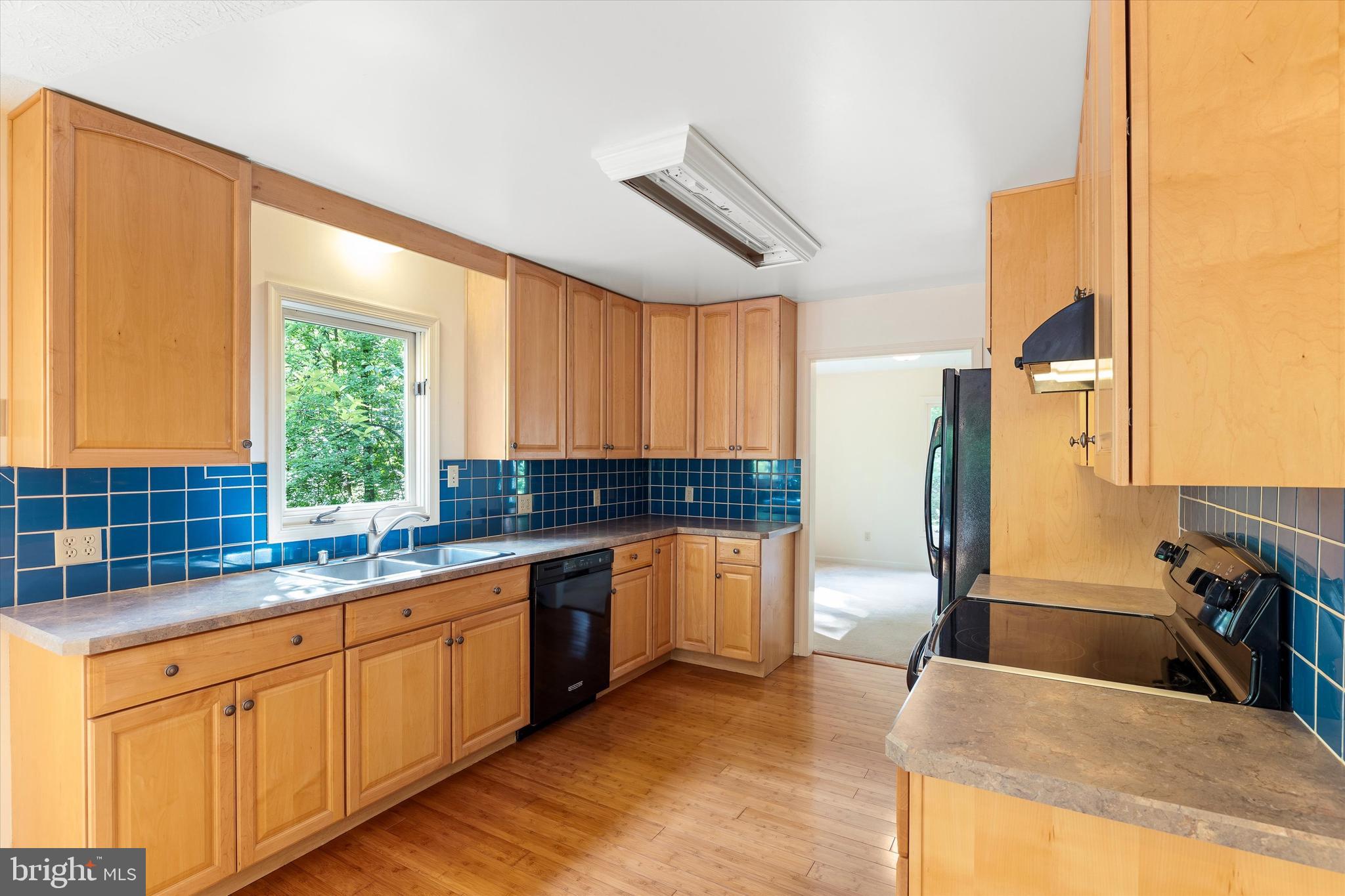 112 Old Forest Circle Winchester, VA 22602 - Photo 18 of 77 a kitchen with stainless steel appliances granite countertop a sink a stove and a refrigerator