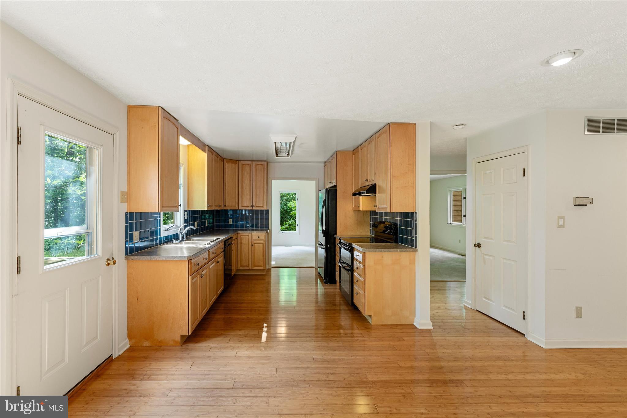 112 Old Forest Circle Winchester, VA 22602 - Photo 20 of 77 a kitchen with a refrigerator and a stove top oven