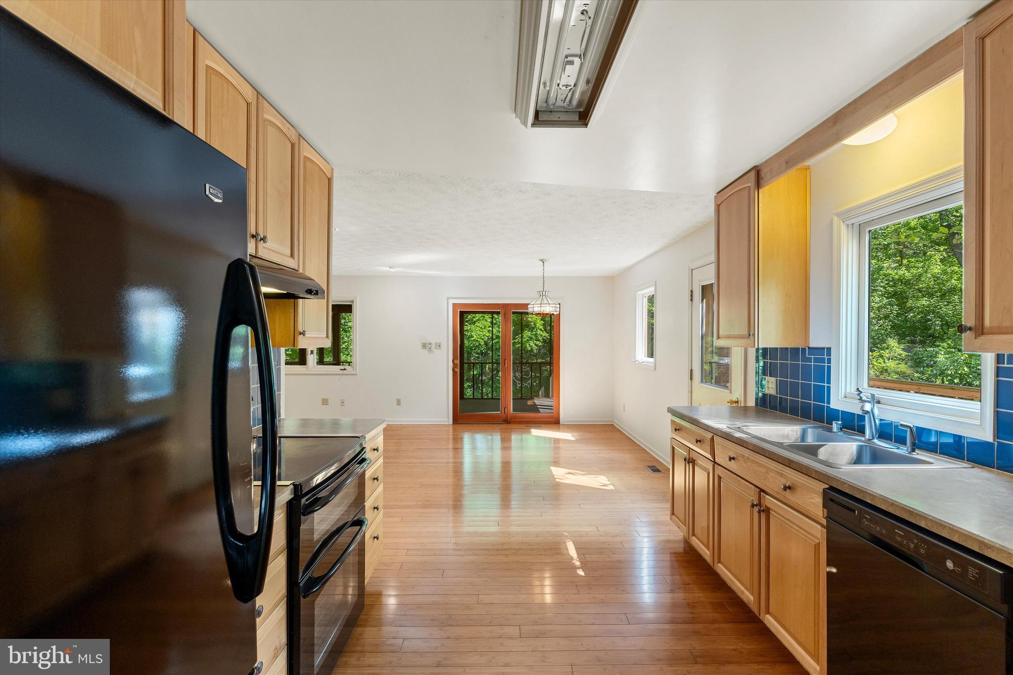 112 Old Forest Circle Winchester, VA 22602 - Photo 21 of 77 a large kitchen with stainless steel appliances a large window and a counter top space