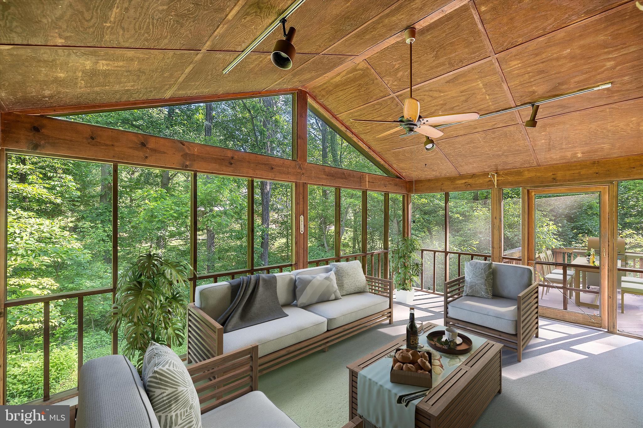 112 Old Forest Circle Winchester, VA 22602 - Photo 52 of 77 a living room with furniture and a floor to ceiling window