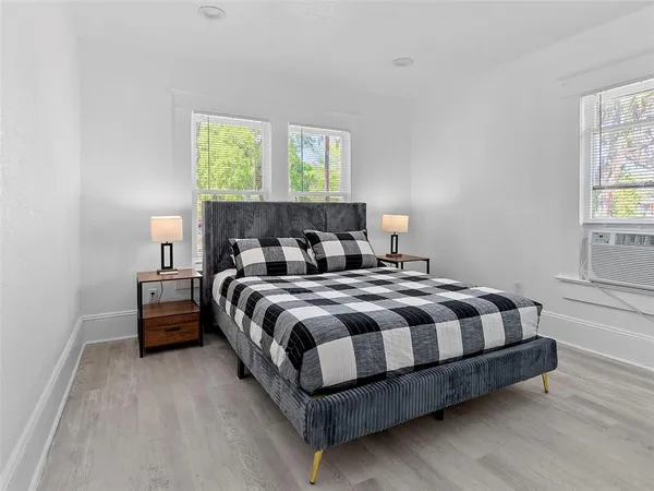 a bedroom with a bed and window