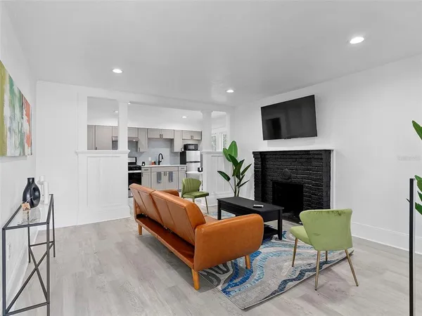 a living room with furniture and a fireplace
