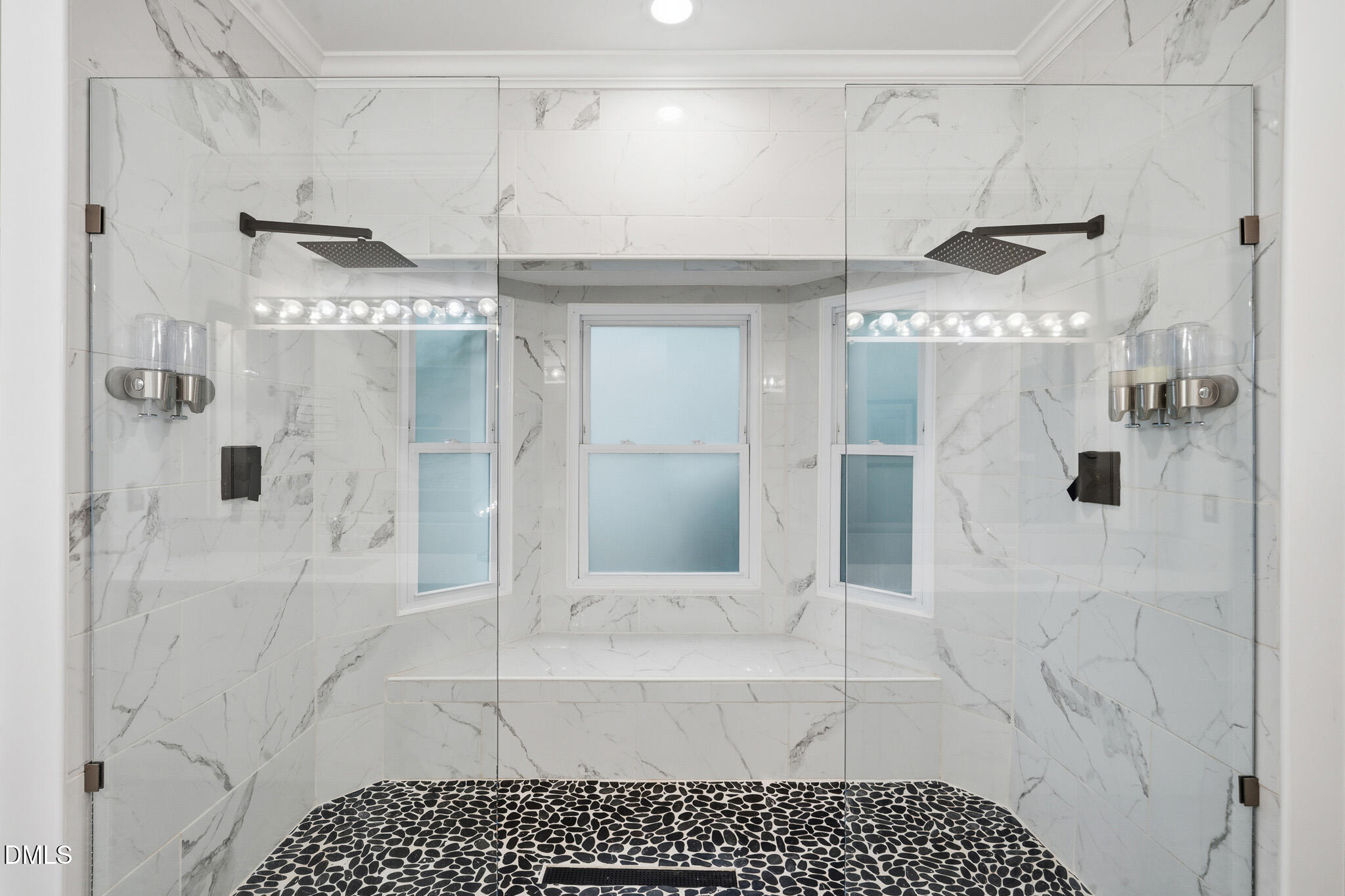 3735 Stoneybrook Drive Durham, NC 27705 - Photo 24 of 44 a bathroom with a glass shower door