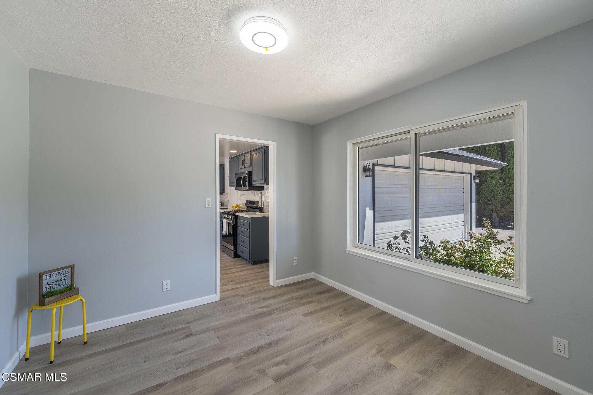2305 Cochran Street Simi Valley, CA 93065 - Photo 11 of 43 a view of an empty room with wooden floor and a window
