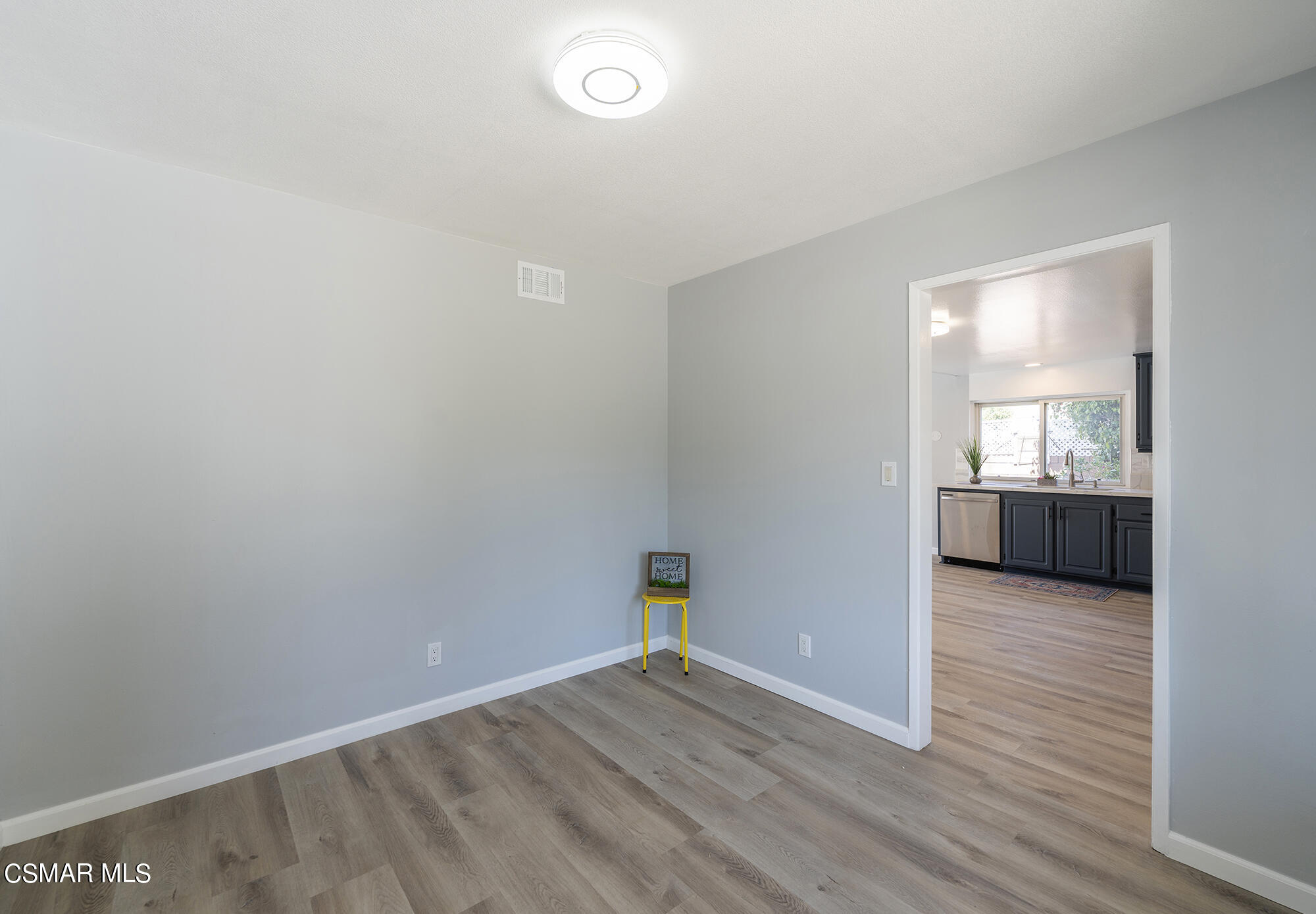 2305 Cochran Street Simi Valley, CA 93065 - Photo 12 of 43 a view of a room with wooden floor and a sink