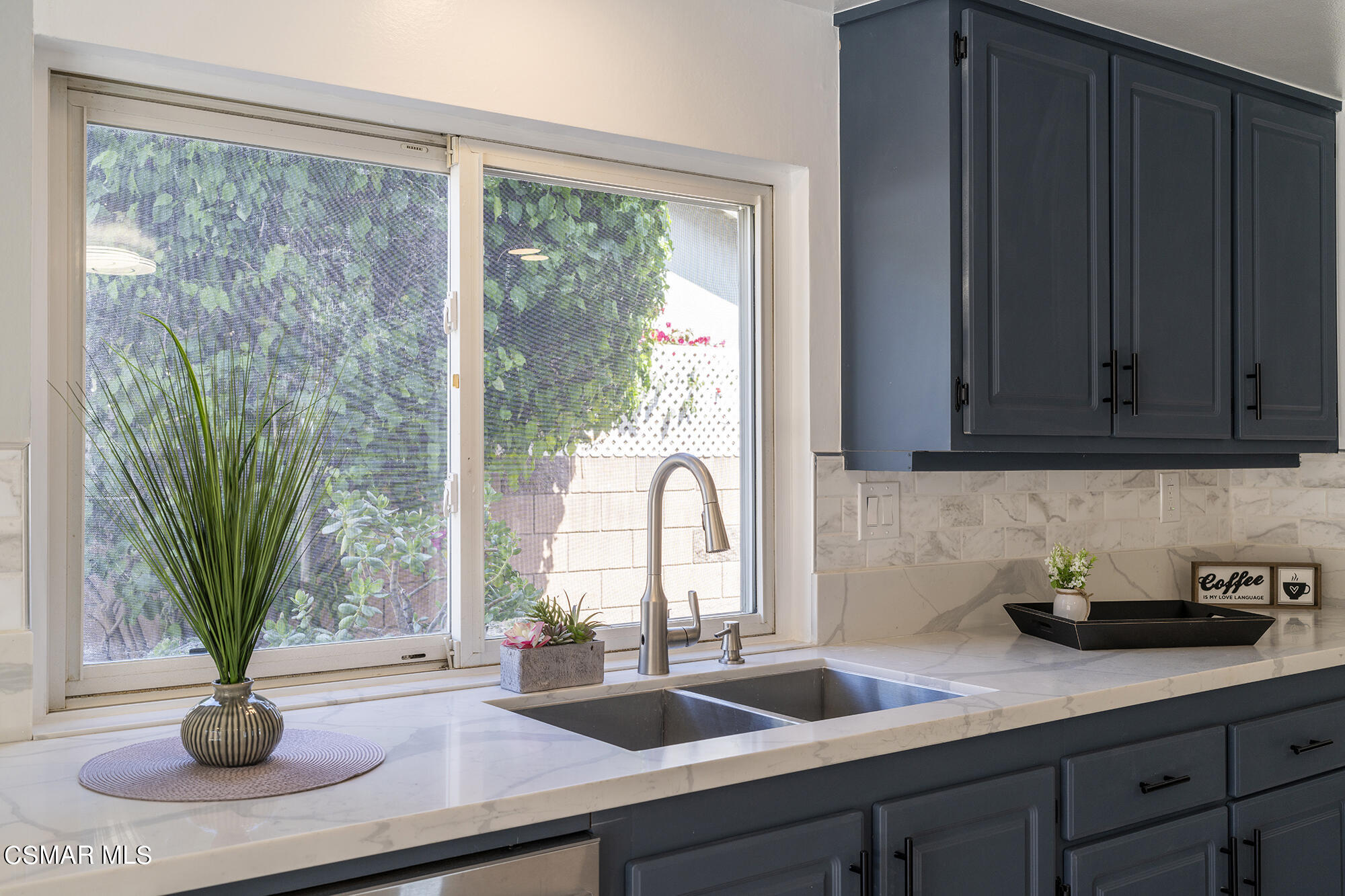 2305 Cochran Street Simi Valley, CA 93065 - Photo 15 of 43 a kitchen with a sink a counter and a window