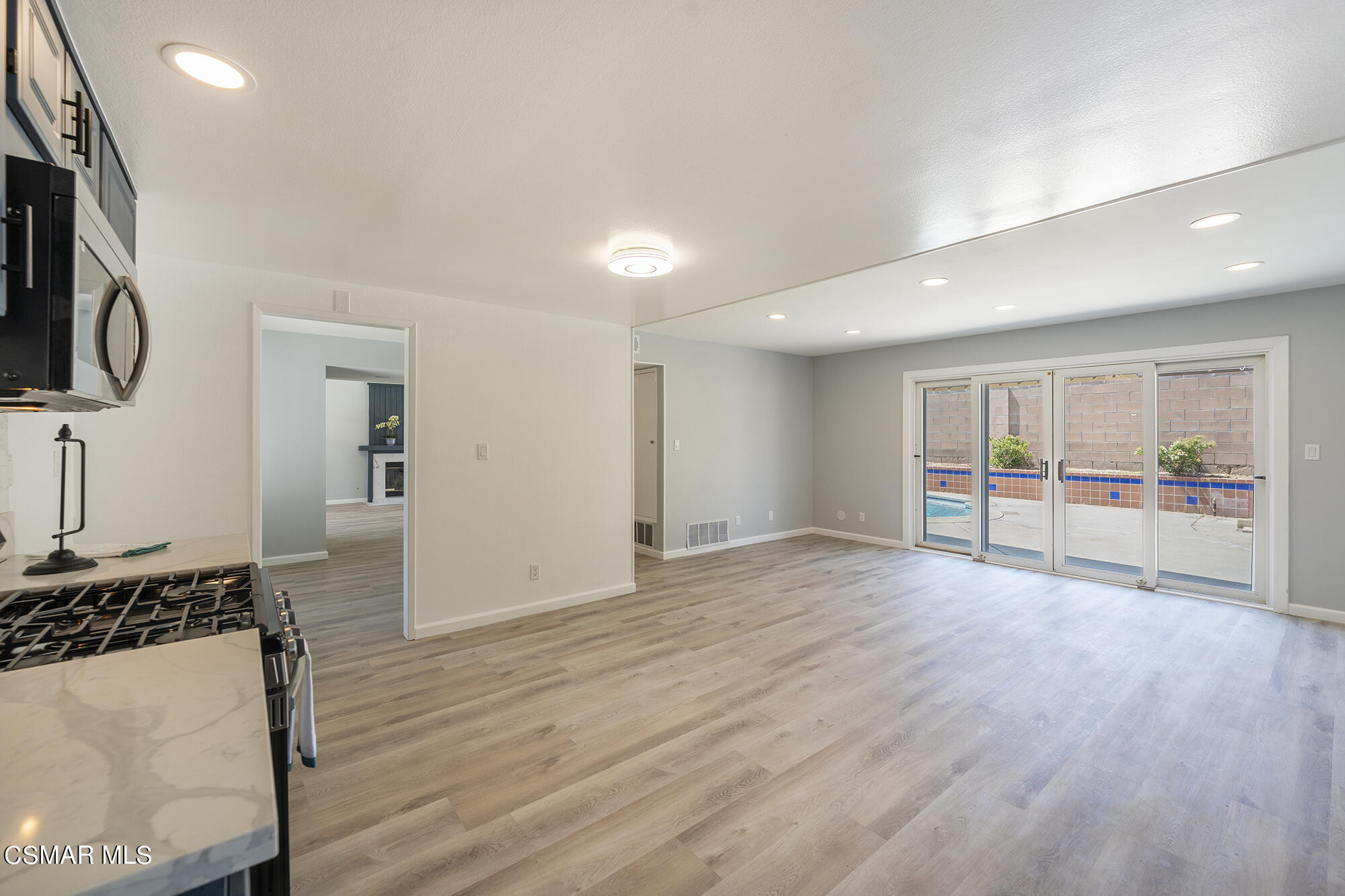 2305 Cochran Street Simi Valley, CA 93065 - Photo 20 of 43 a view of an empty room with wooden floor and a window