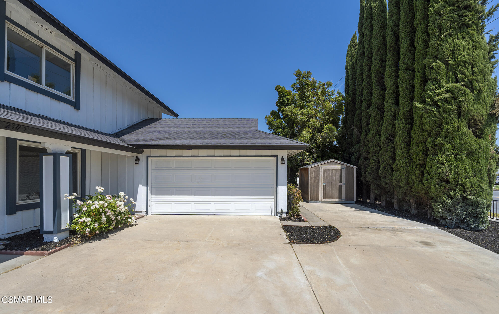2305 Cochran Street Simi Valley, CA 93065 - Photo 2 of 43 a backyard of a house with potted plants and trees