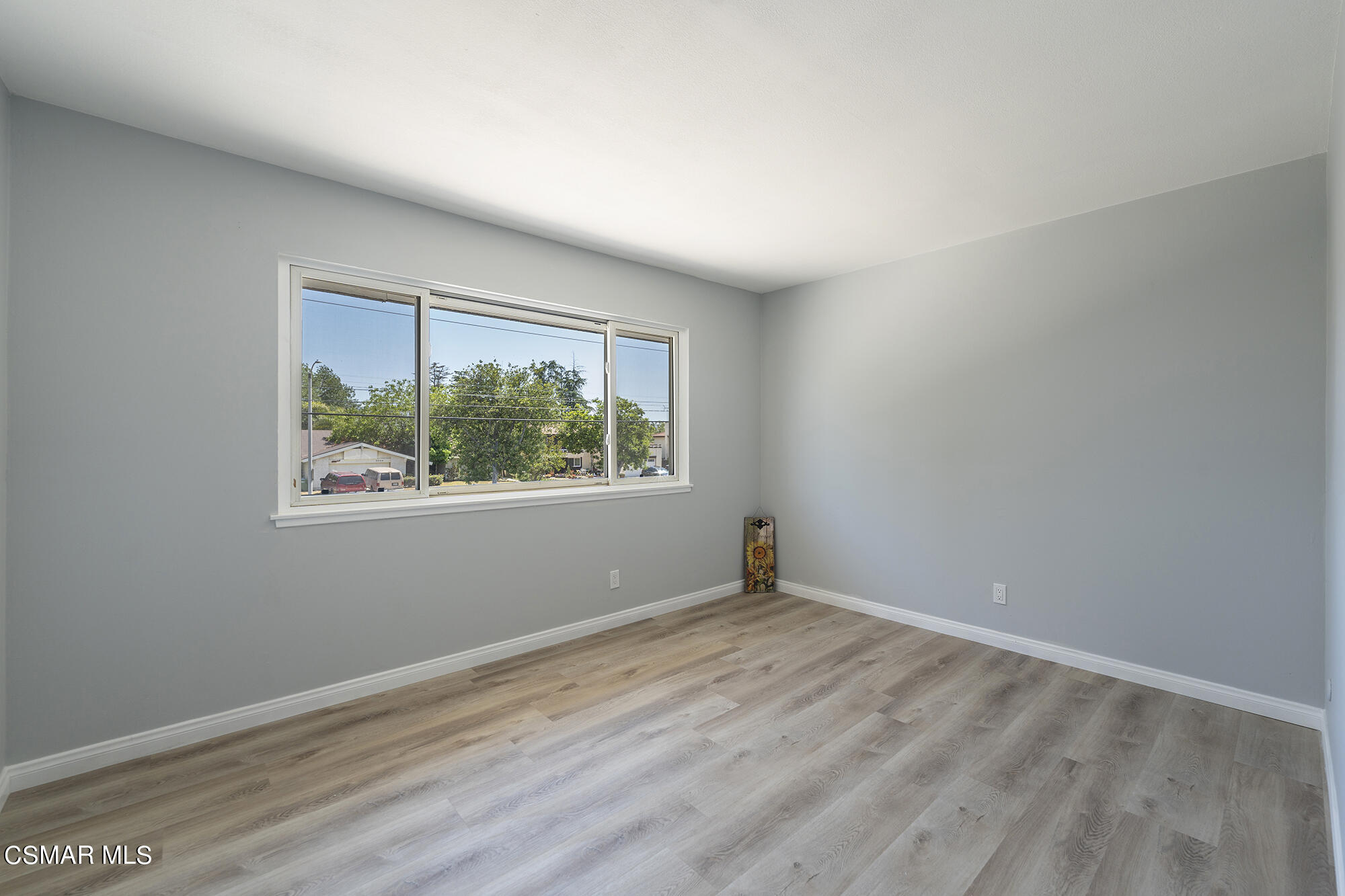 2305 Cochran Street Simi Valley, CA 93065 - Photo 24 of 43 wooden floor in an empty room with a window