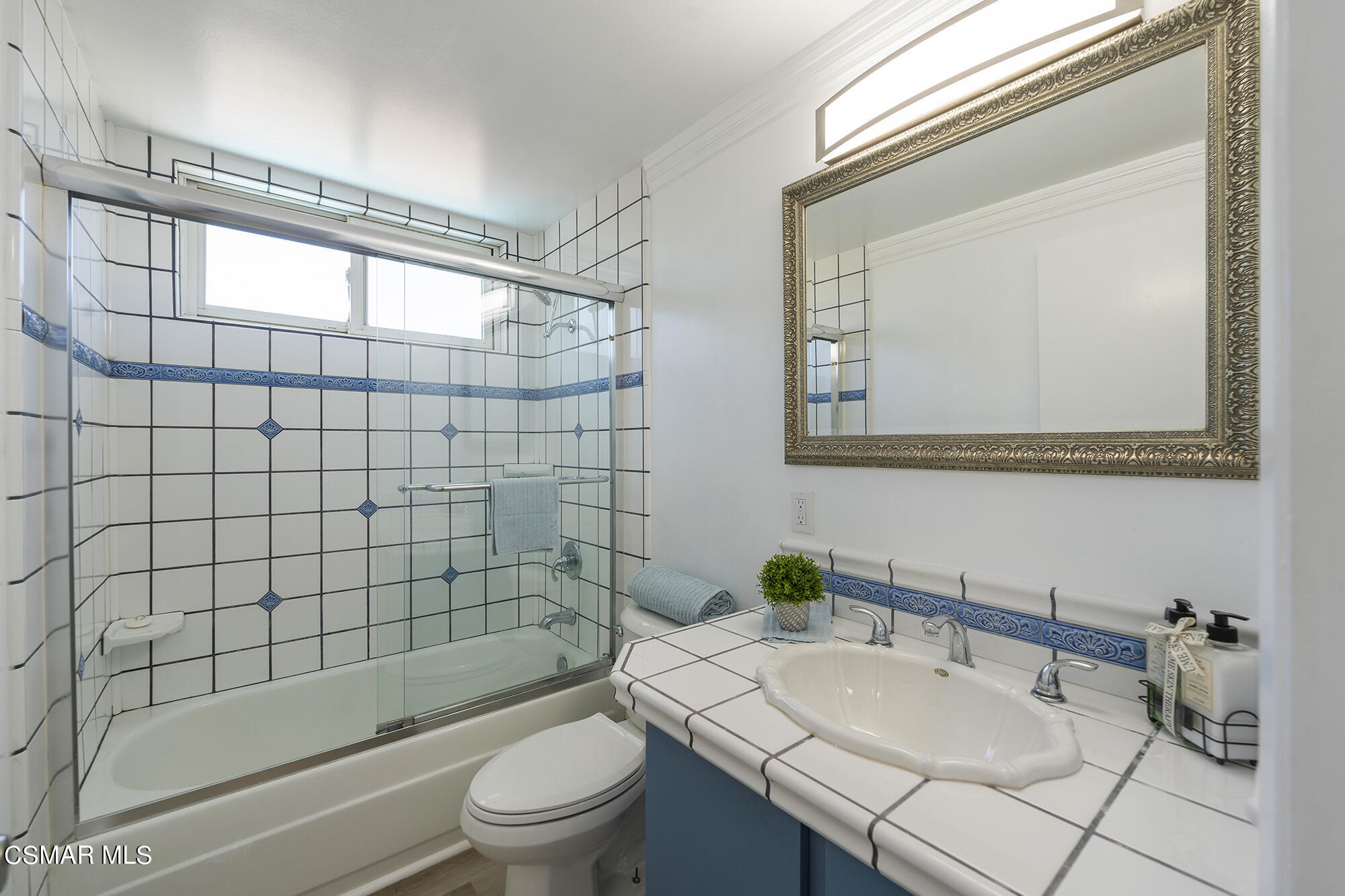 2305 Cochran Street Simi Valley, CA 93065 - Photo 28 of 43 a bathroom with a sink a toilet and shower