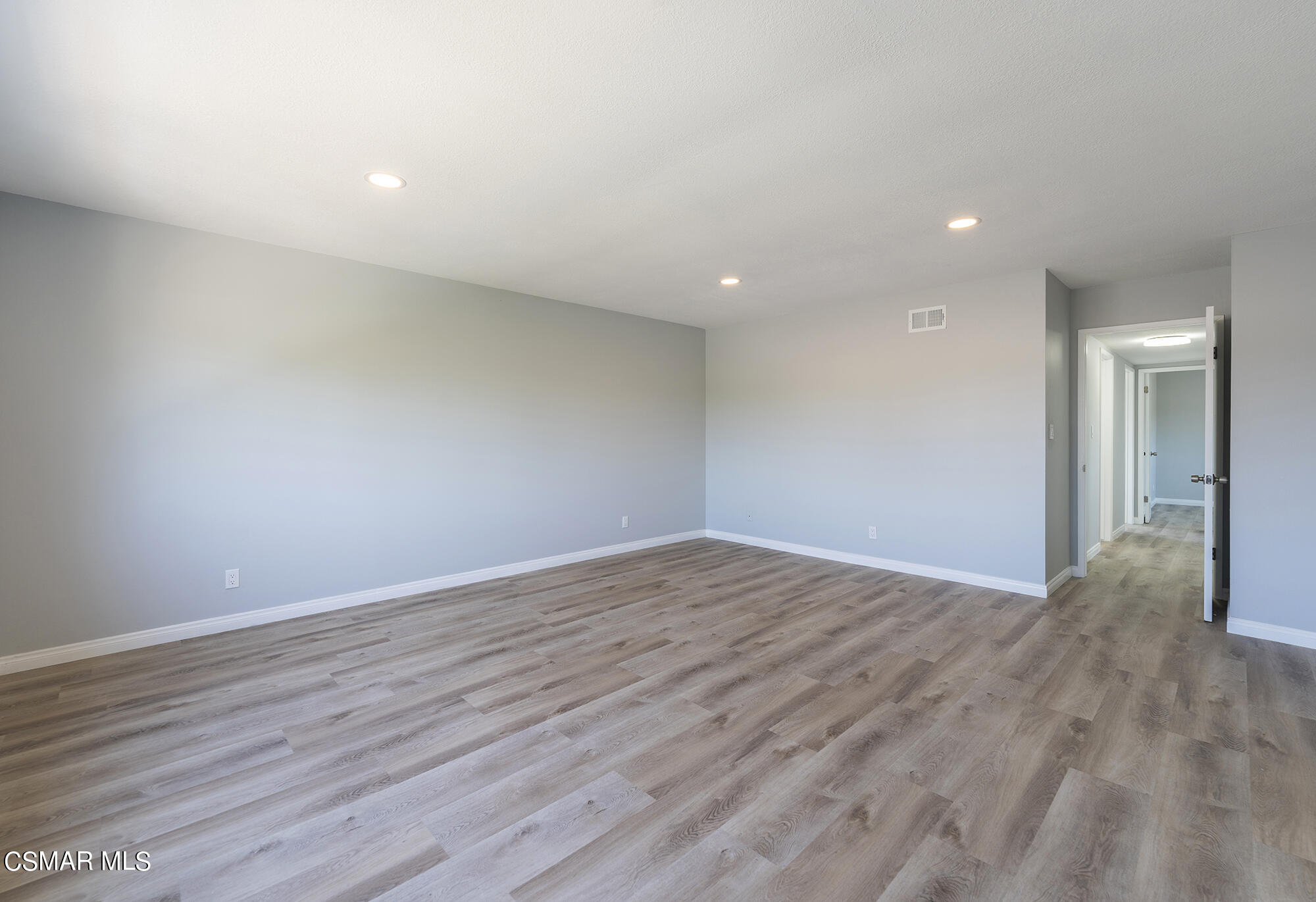 2305 Cochran Street Simi Valley, CA 93065 - Photo 31 of 43 a view of an empty room with wooden floor and closet