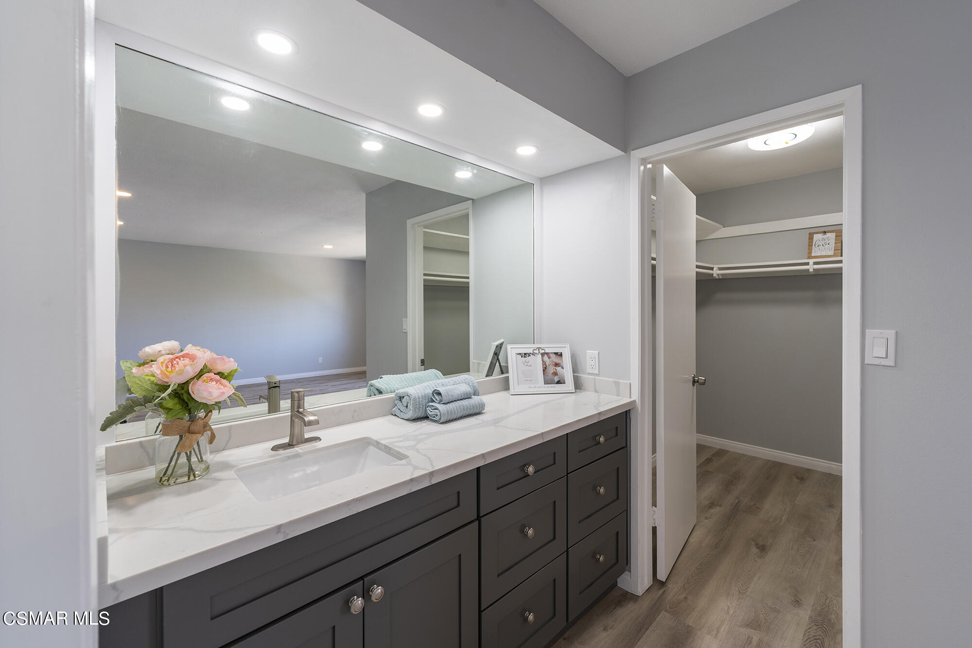 2305 Cochran Street Simi Valley, CA 93065 - Photo 33 of 43 a bathroom with a sink double vanity and mirror