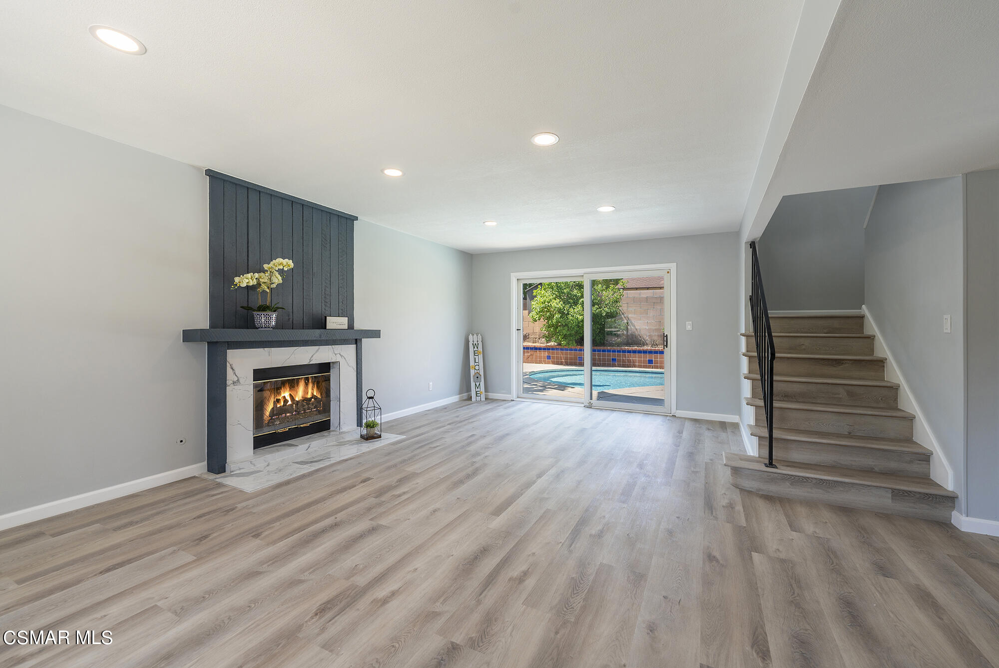 2305 Cochran Street Simi Valley, CA 93065 - Photo 5 of 43 a view of an empty room with a fireplace and a window