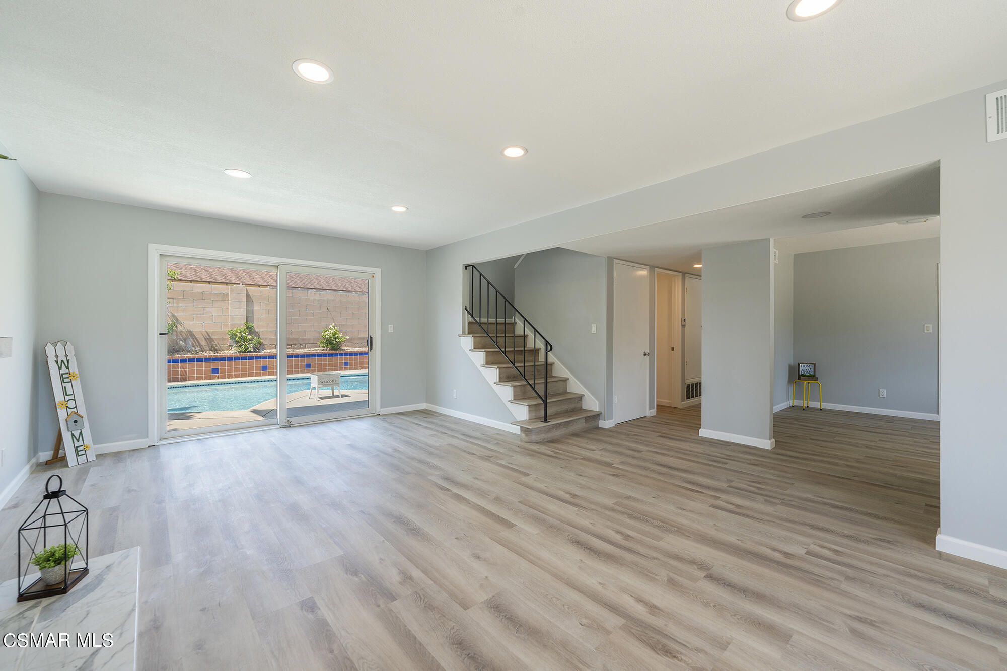 2305 Cochran Street Simi Valley, CA 93065 - Photo 9 of 43 a view of an empty room with wooden floor and a window