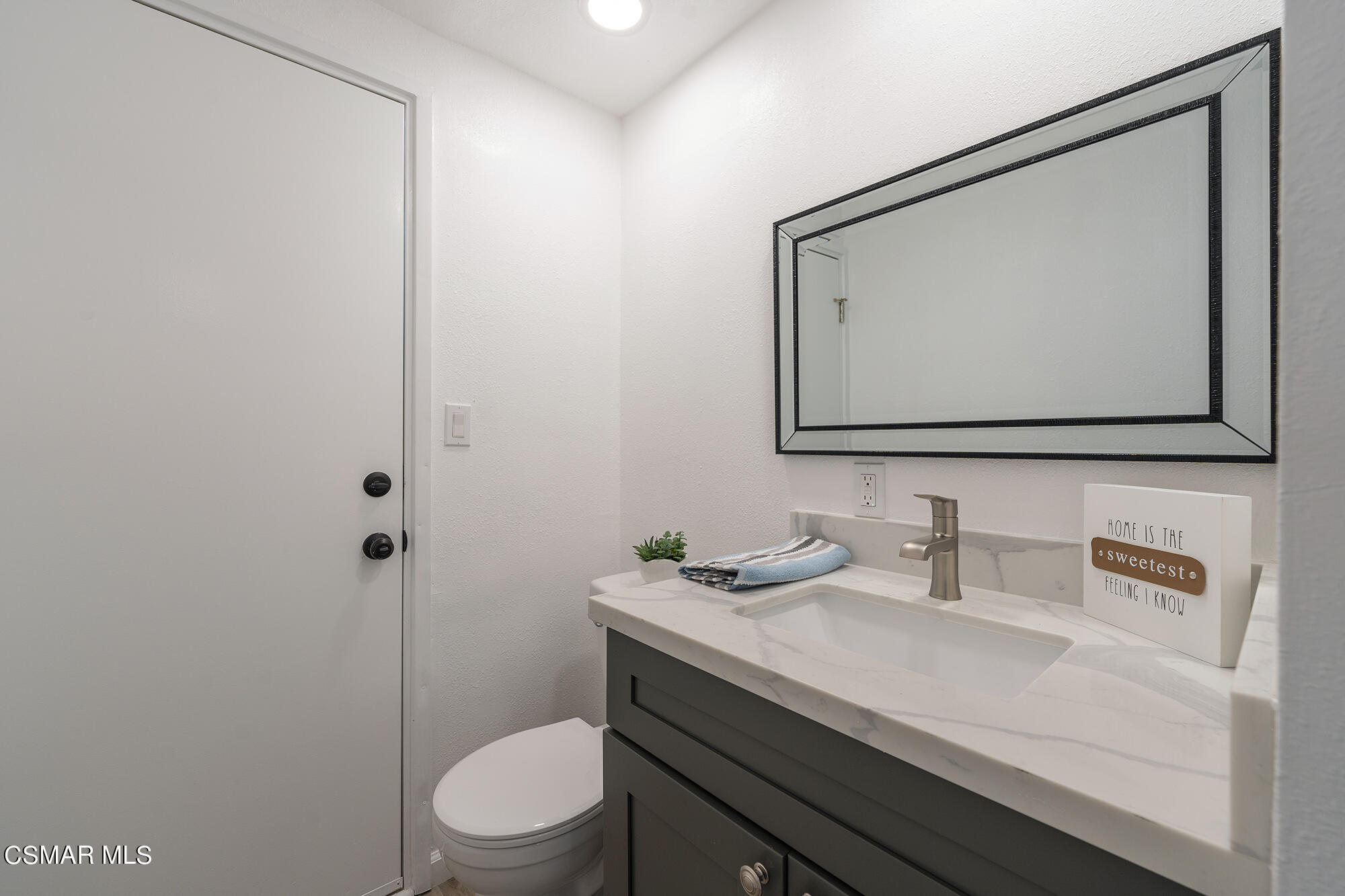 2305 Cochran Street Simi Valley, CA 93065 - Photo 10 of 43 a bathroom with a toilet sink and mirror
