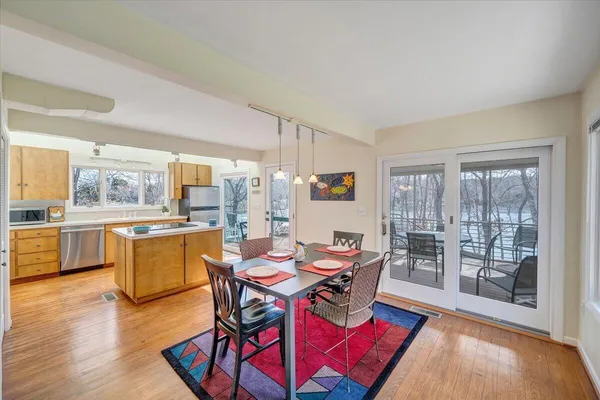 an aerial view of a houses with a lake view