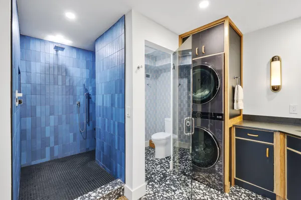 a kitchen with a sink and a mirror
