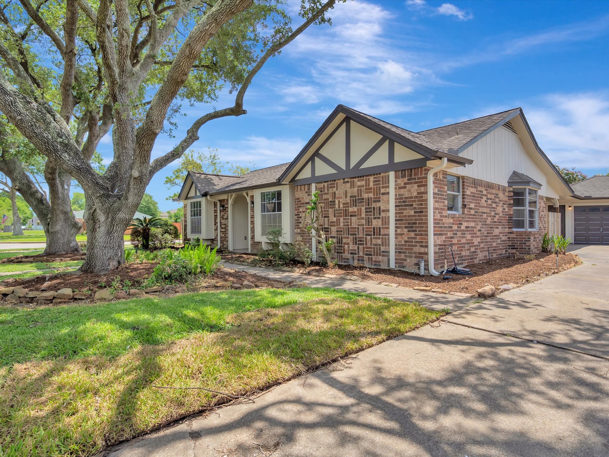 10340 Rocky Hollow Road La Porte, TX 77571 - Photo 2 of 38 Beautifully landscaped exterior with well-maintained gardens.