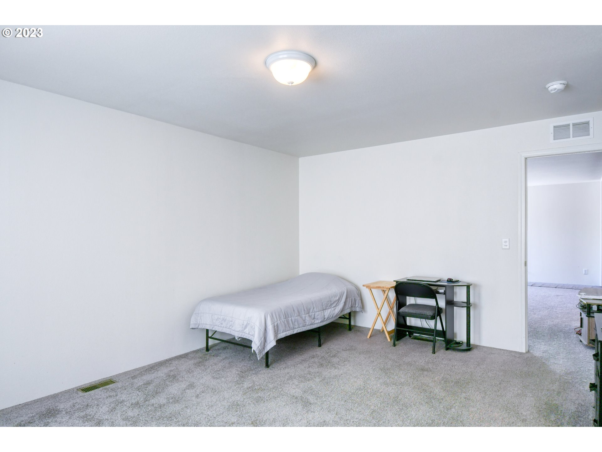 301 Northwest 3rd Street Boardman, OR 97818 - Photo 11 of 31 a living room with furniture and a chair