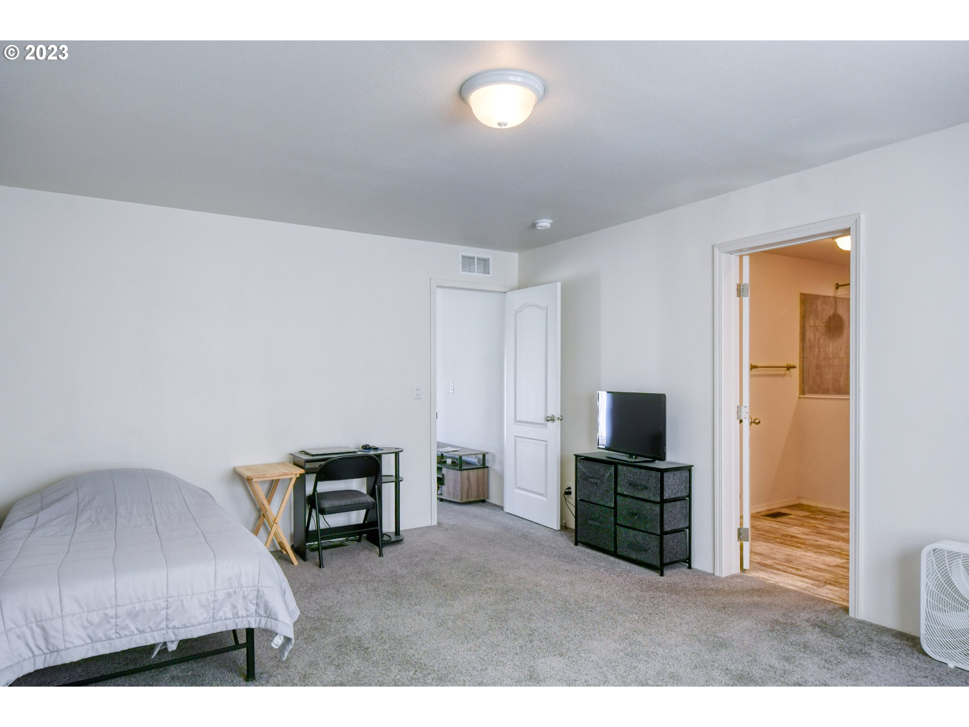 301 Northwest 3rd Street Boardman, OR 97818 - Photo 13 of 31 a living room with furniture and a flat screen tv