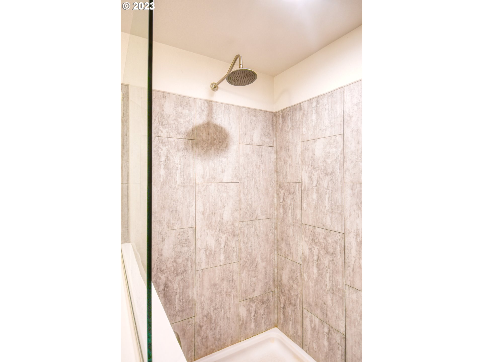 301 Northwest 3rd Street Boardman, OR 97818 - Photo 15 of 31 a bathroom with a shower and a sink
