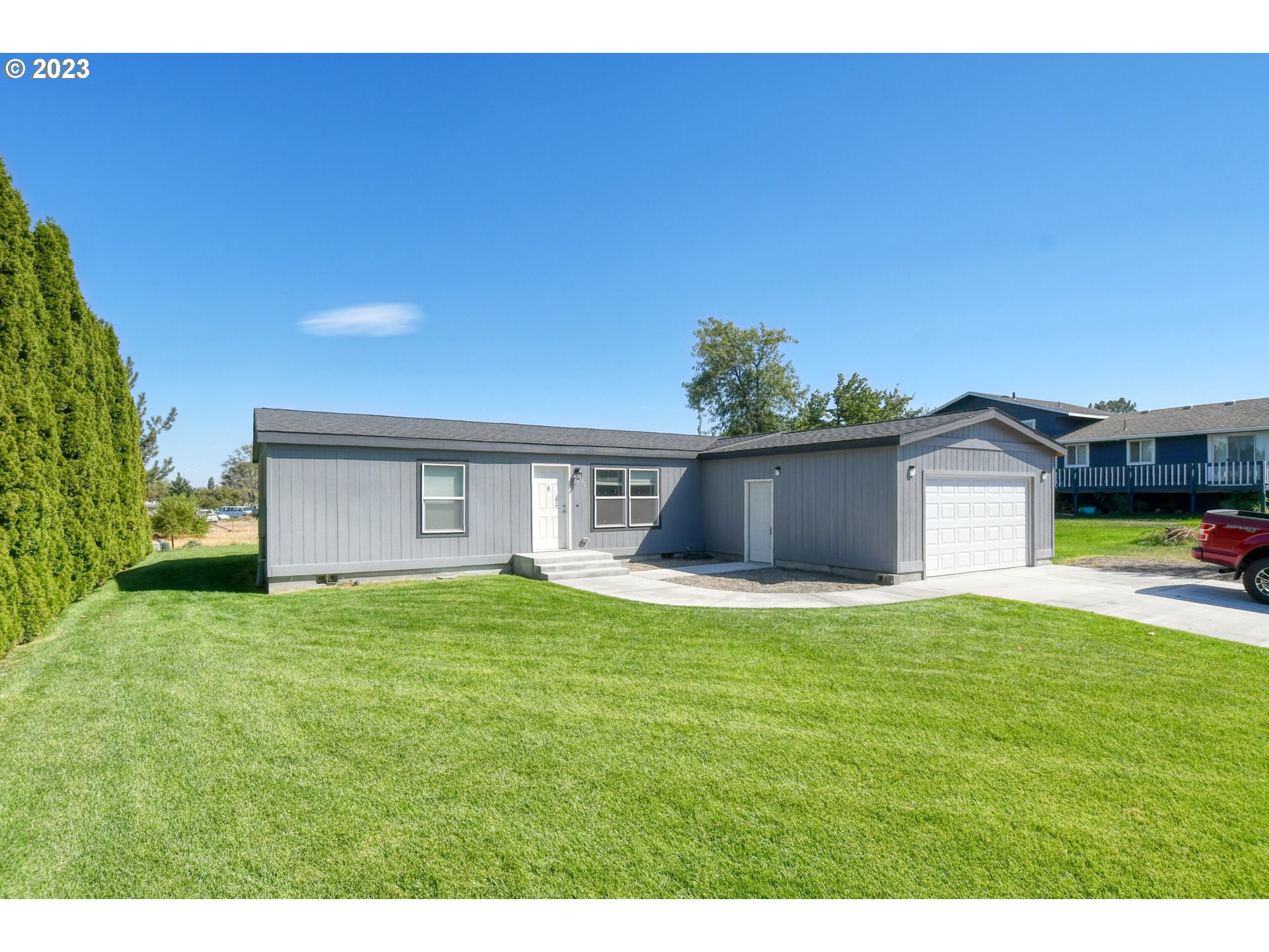 301 Northwest 3rd Street Boardman, OR 97818 - Photo 2 of 31 a house view with a garden space