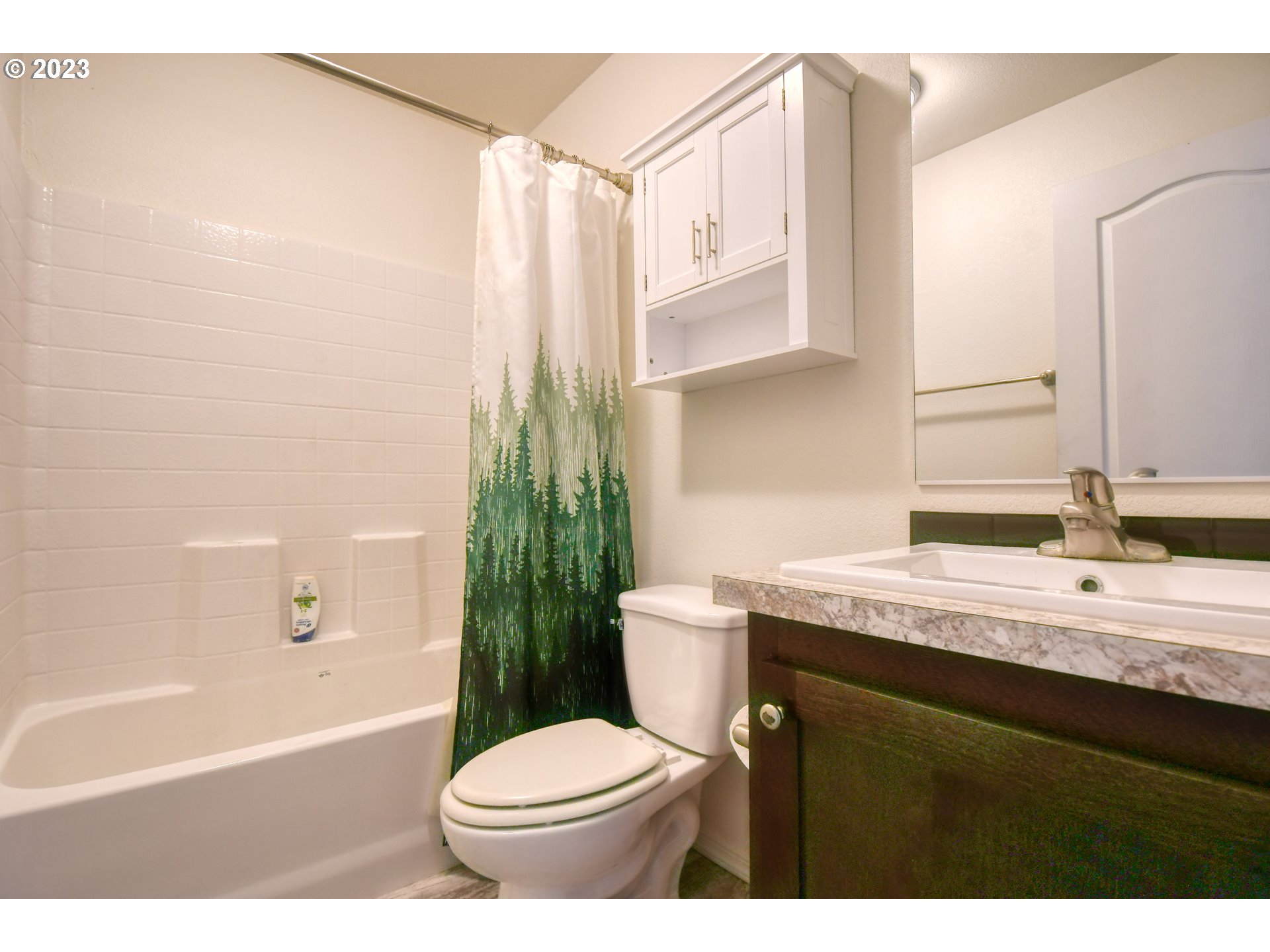 301 Northwest 3rd Street Boardman, OR 97818 - Photo 25 of 31 a bathroom with a granite countertop sink toilet and shower