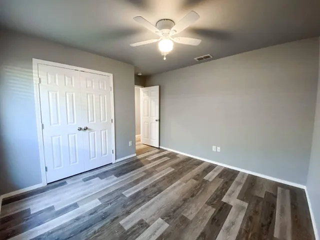 a view of entryway with wooden floor