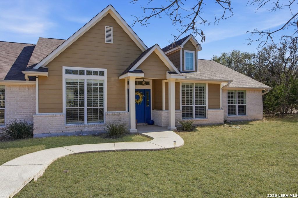 318 River Ridge Boerne, TX 78006 - Photo 2 of 46 a front view of a house with yard and porch