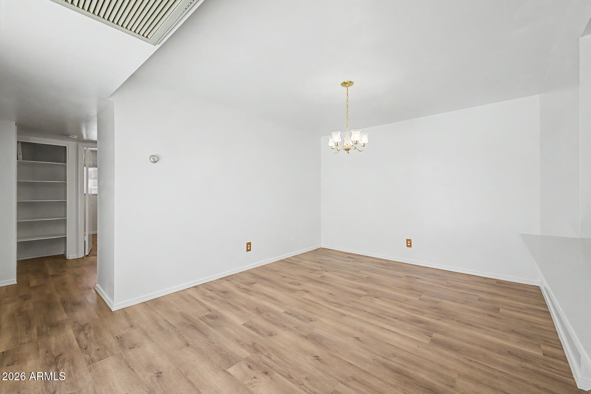 5873 East Thomas Road Scottsdale, AZ 85251 - Photo 6 of 30 wooden floor in an empty room with a window