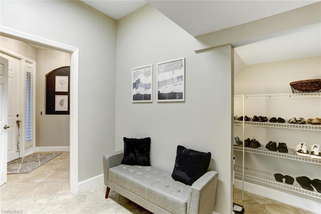 14966 Summit Pl Circle Naples, FL 34119 - Photo 11 of 14 a living room with furniture and wooden floor