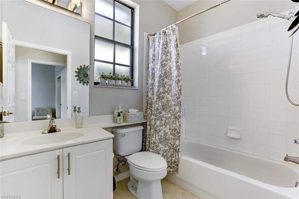 14966 Summit Pl Circle Naples, FL 34119 - Photo 6 of 14 a bathroom with a sink toilet and shower