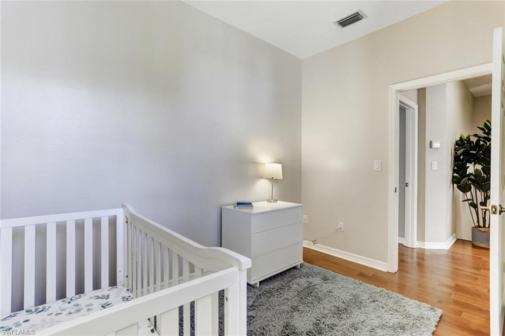 14966 Summit Pl Circle Naples, FL 34119 - Photo 7 of 14 a view of an entryway with wooden floor