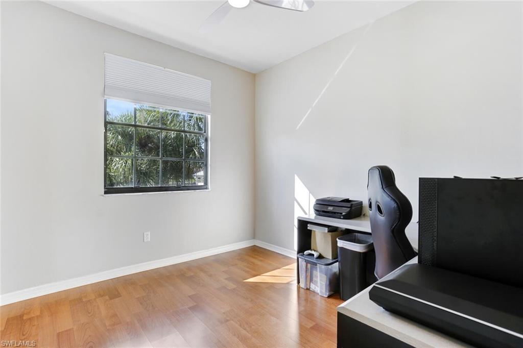 14966 Summit Pl Circle Naples, FL 34119 - Photo 8 of 14 a view of workspace with wooden floor workspace