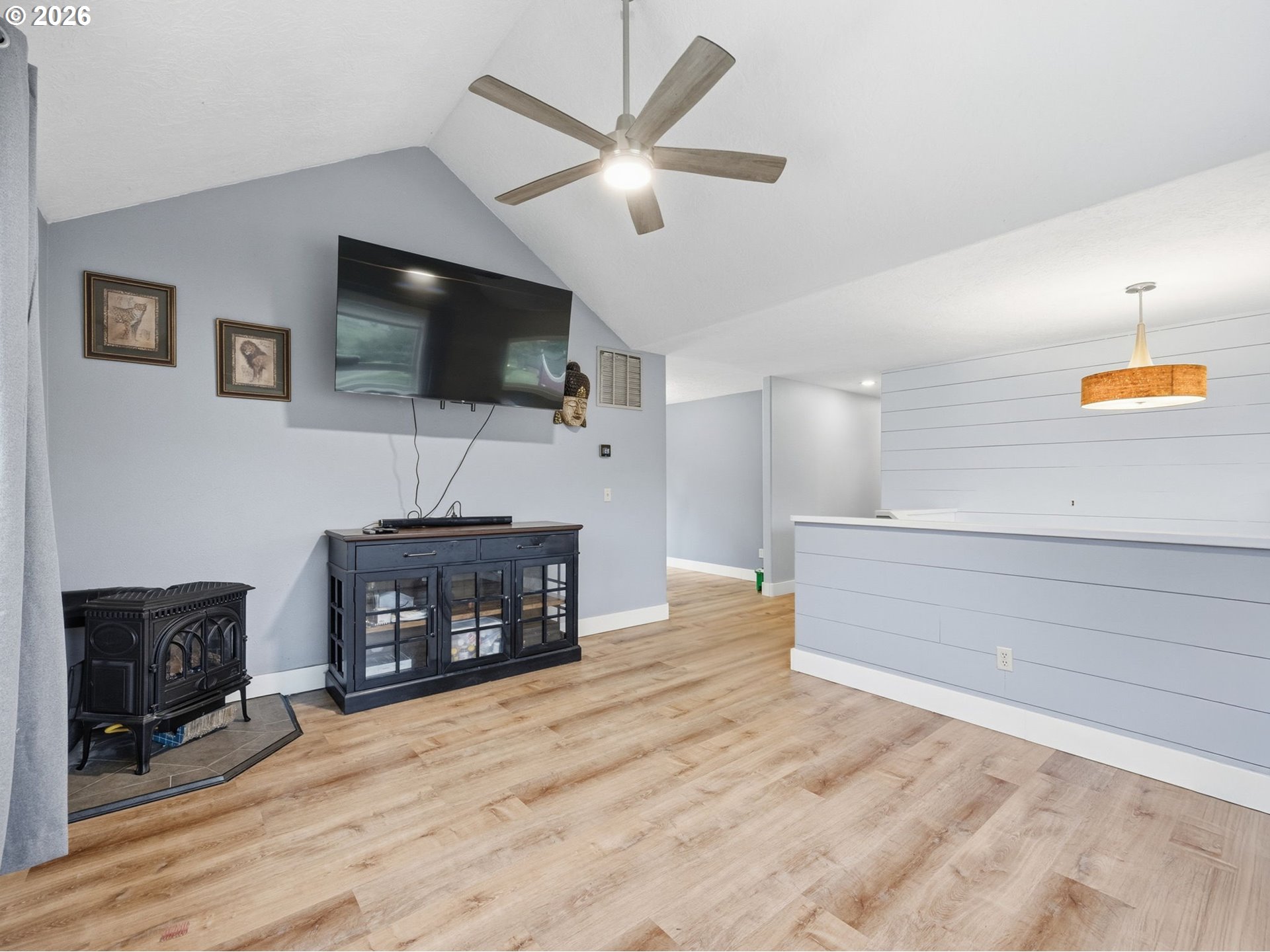 92085 Akerstedt Road Astoria, OR 97103 - Photo 9 of 48 a living room with furniture a flat screen tv and a fireplace