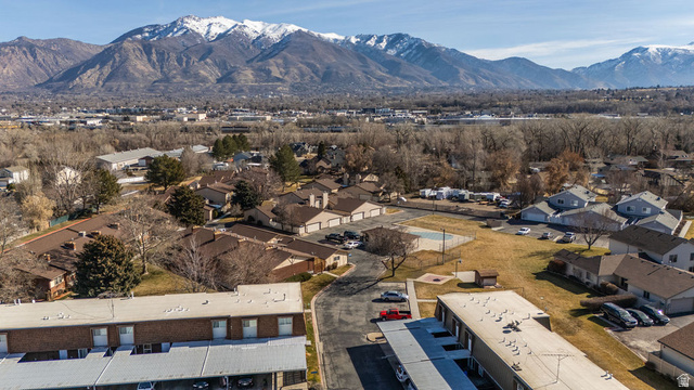 621 Coachman Way Riverdale, UT 84405 - Photo 38 of 38 Aerial perspective of suburban area with a mountain backdrop