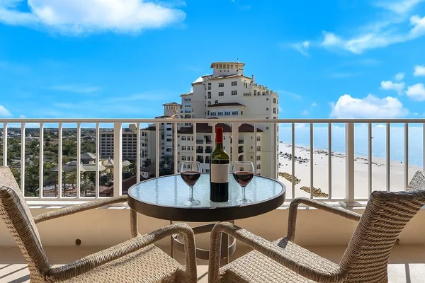 a view of a balcony with table and chairs