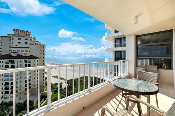 a view of a balcony with furniture