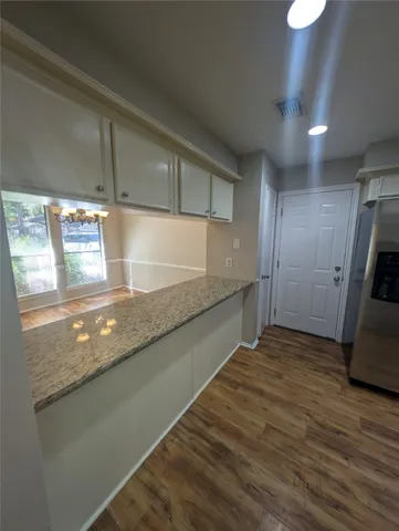 a view of a kitchen with a sink and dishwasher