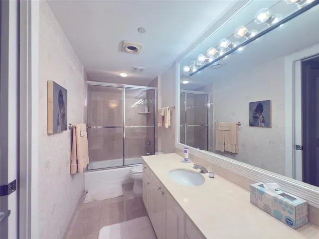 a bathroom with a shower and a door