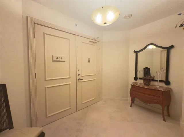 a bathroom with a sink a toilet and shower curtain