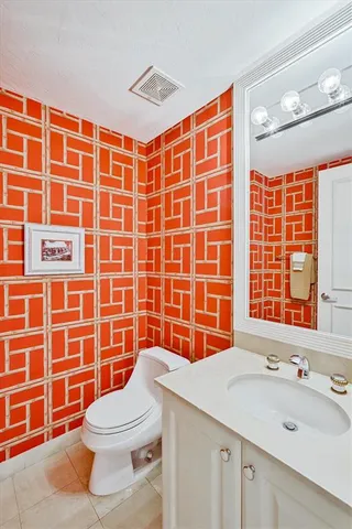 a kitchen with a stove a sink and a refrigerator