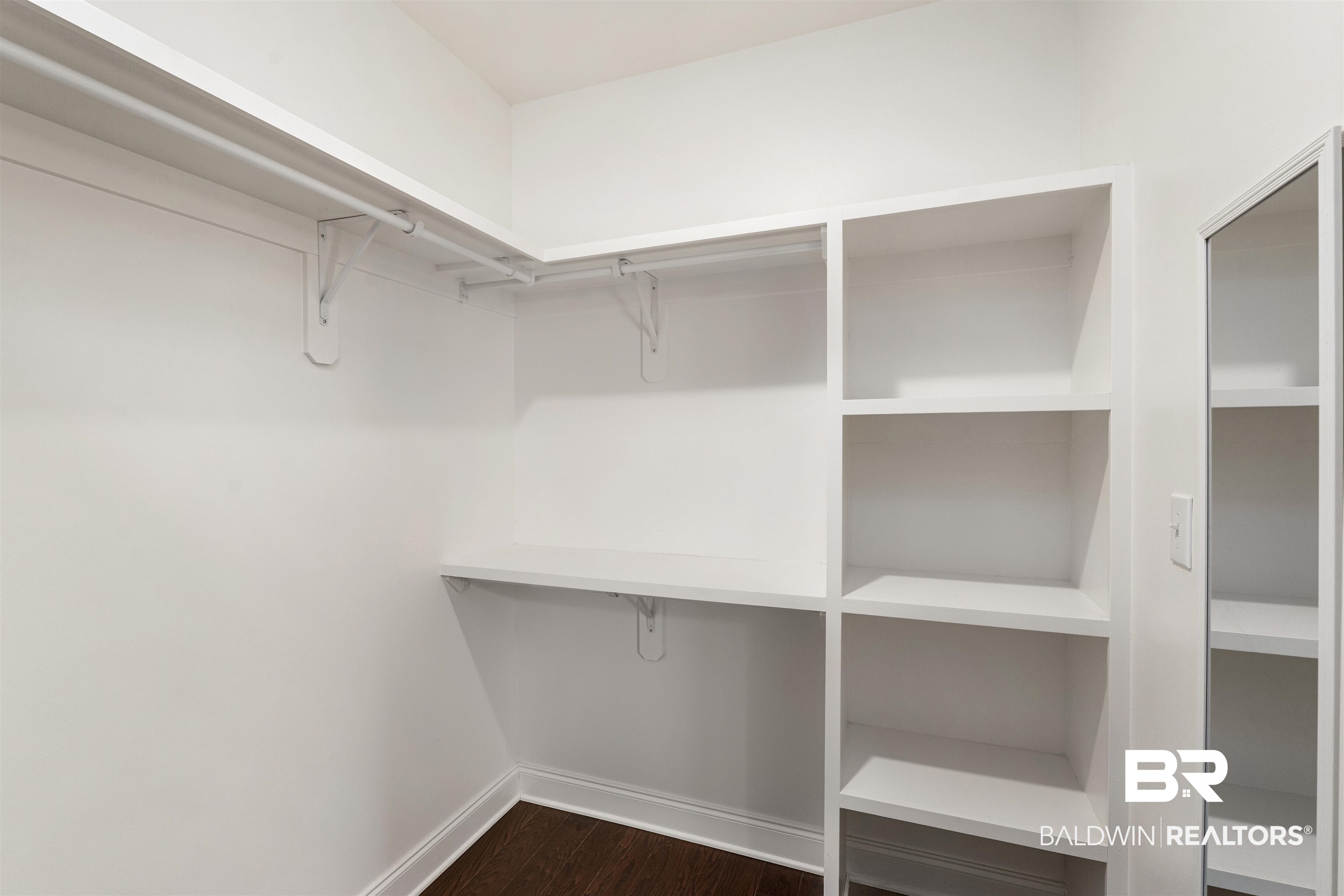 24838 Slater Mill Road Daphne, AL 36526 - Photo 39 of 46 Walk in closet with dark wood-type flooring