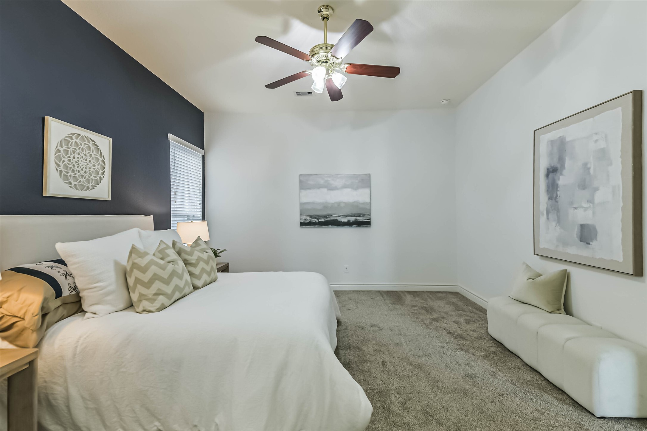 19022 Greenleaf Ridge Court Cypress, TX 77429 - Photo 25 of 47 a bedroom with a bed and a couch