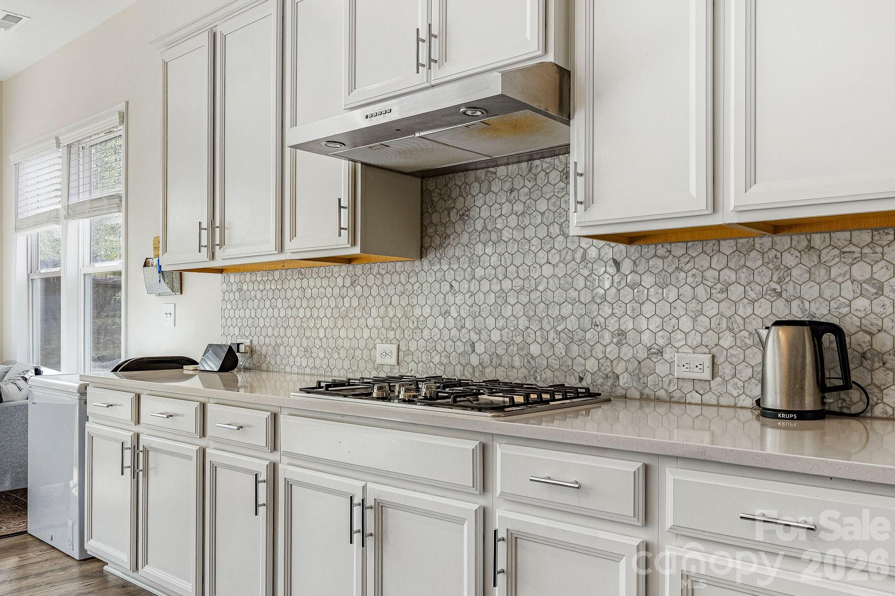 2036 Oliver Terrace Fort Mill, SC 29707 - Photo 15 of 41 a kitchen with stainless steel appliances granite countertop a sink a stove and cabinets