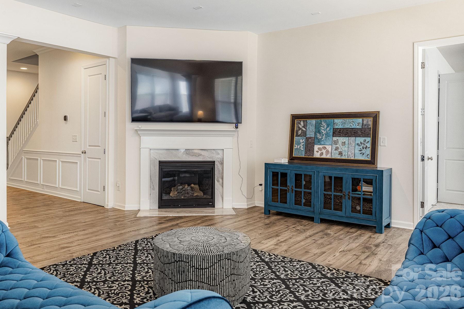 2036 Oliver Terrace Fort Mill, SC 29707 - Photo 18 of 41 a living room with furniture a flat screen tv and a fireplace