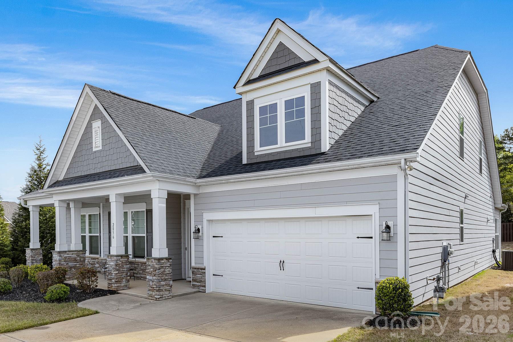 2036 Oliver Terrace Fort Mill, SC 29707 - Photo 2 of 41 a front view of a house with garden
